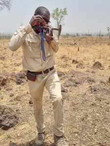 Senior Geologist Cn Inspecting A Rock Chip